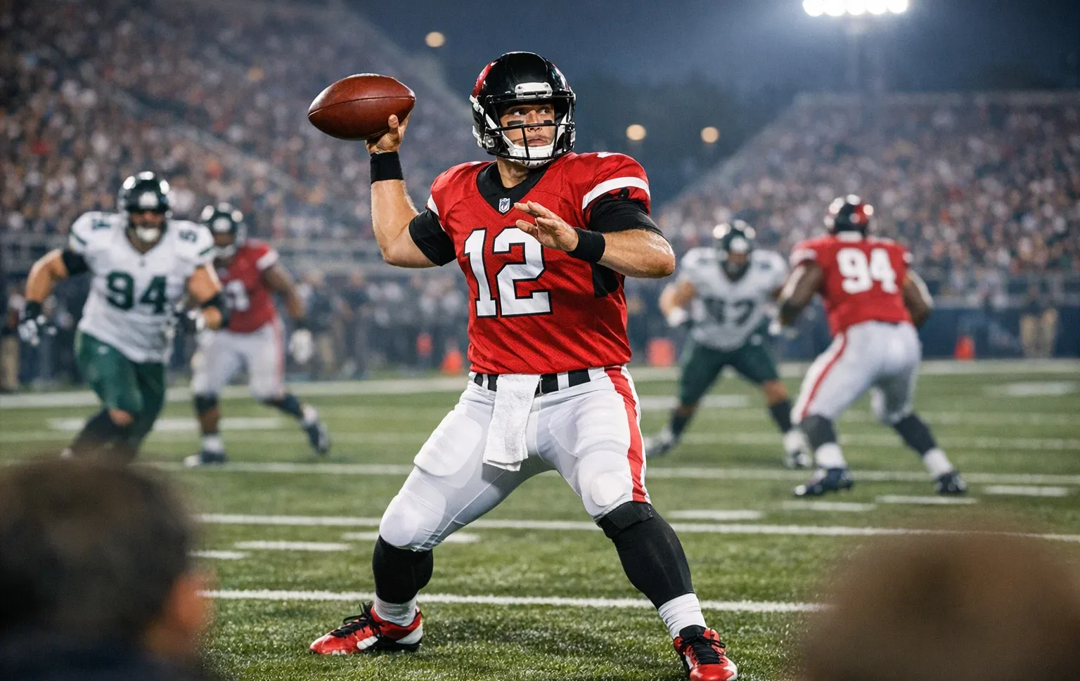 Partita di football americano NFL vista dallo stadio durante un'azione di gioco serale
